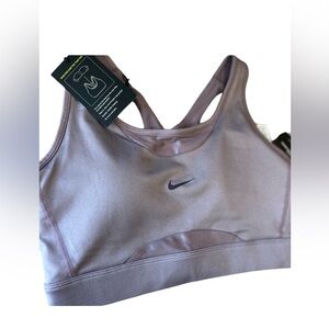 NWT- Women’s Nike med support sports bra. One piece padded system.